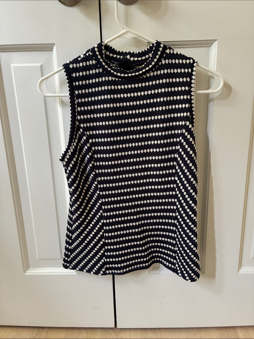 Sleeveless Navy and White Striped Knit Top
